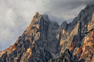 Low angle view of rock against sky