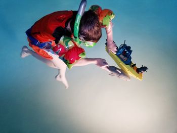 High angle view of boy swimming in pool