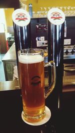 Close-up of beer glass on table