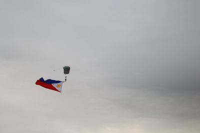 Low angle view of flag against sky