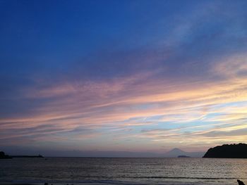 Scenic view of sea against sky at sunset