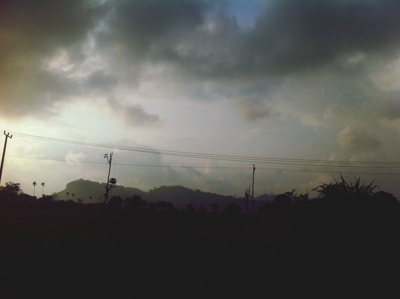 power line, electricity pylon, sky, silhouette, electricity, power supply, cloud - sky, fuel and power generation, cable, cloudy, tranquility, low angle view, connection, landscape, tranquil scene, nature, dusk, scenics, sunset, cloud