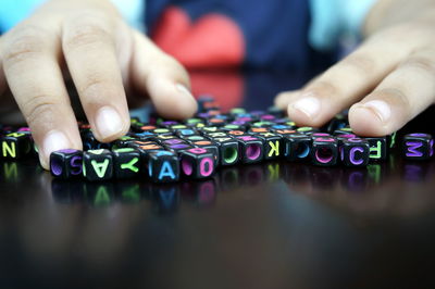 Close-up of hands playing piano