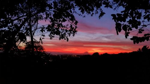 Silhouette landscape against scenic sky