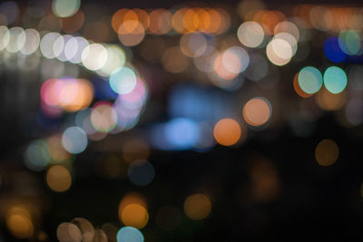 Defocused image of illuminated lights at night