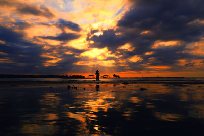 Silhouette of people on beach