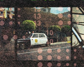 Car on street seen through wet window