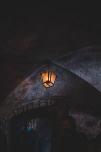 Low angle view of illuminated lantern hanging on ceiling