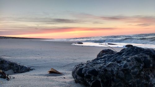 Scenic view of sea at sunset