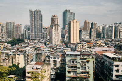 Aerial view of modern buildings in city against sky