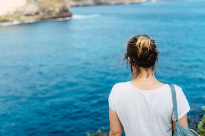 Rear view of woman looking at sea