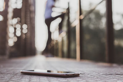 Close-up of person on table by street