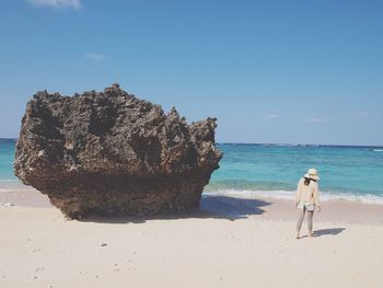 Scenic view of beach against blue sky