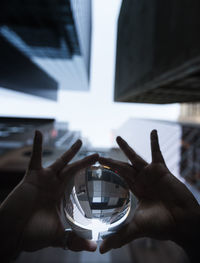 Close-up of hand holding mirror