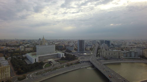 Cityscape against cloudy sky