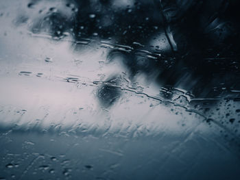 High angle view of raindrops on glass