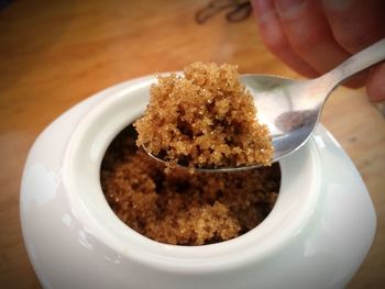 Close-up of hand in plate