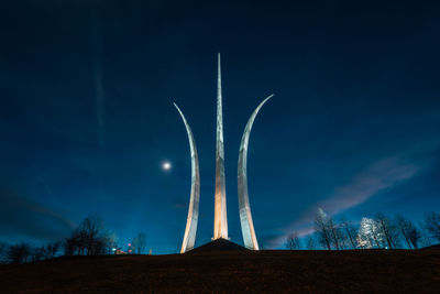 Low angle view of illuminated tree against sky at night