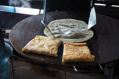 Close-up of serving food on table