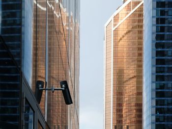 Low angle view of modern buildings against sky