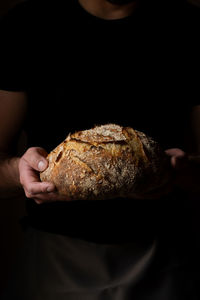 Midsection of man holding food