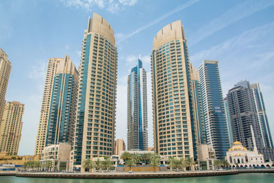 Low angle view of skyscrapers against sky