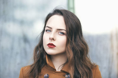 Portrait of a young beautiful woman with bright blue eyes