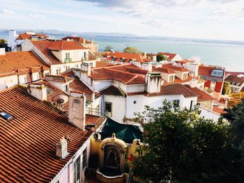 High angle view of houses against sea