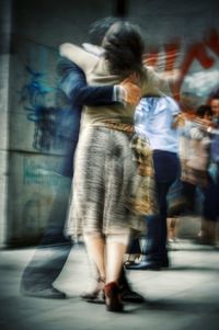 Full length of woman standing on bench