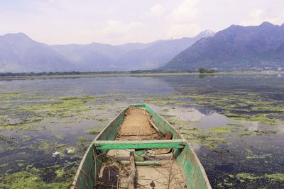 Calm lake with mountains in background