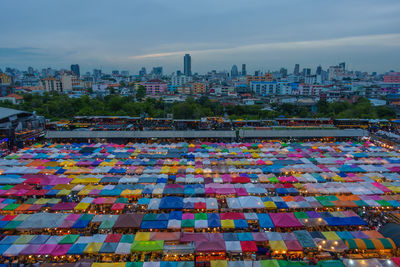 Multi colored cityscape against sky