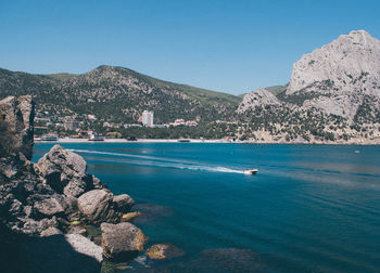 Scenic view of sea against clear blue sky