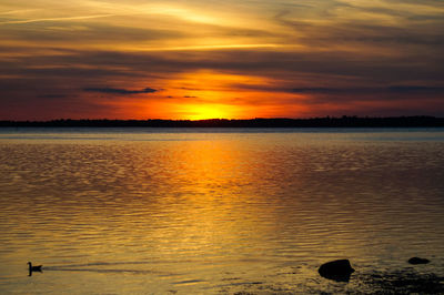 View of calm sea at sunset