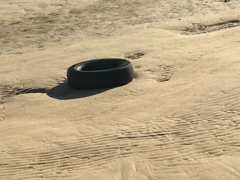 High angle view of shoes on beach