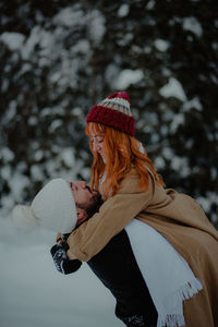 Midsection of woman wearing hat during winter