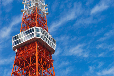 Low angle view of tower against blue sky