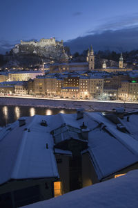 View of illuminated city during winter at night