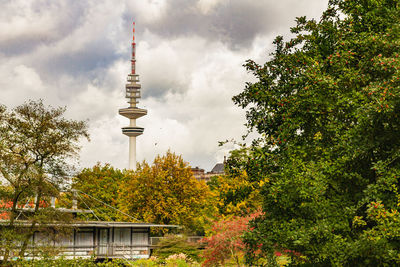 Trees and buildings against sky