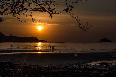 Scenic view of sea against sky at sunset