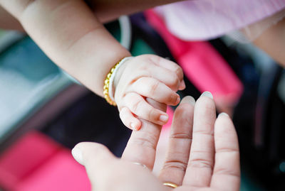 Close-up of hand holding hands