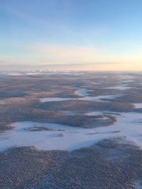 Aerial view of landscape against sky during sunset