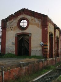 Abandoned building against clear sky