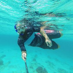 Man swimming in sea