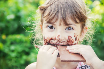 Close-up of young woman eating food