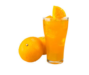 Close-up of orange juice against white background