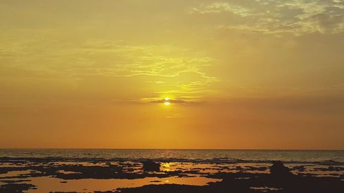 Scenic view of sea at sunset