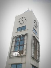 Low angle view of clock tower against sky