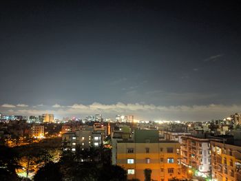 High angle view of buildings against sky at night