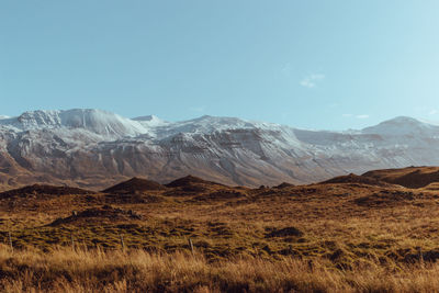 Scenic view of snowcapped mountains against sky