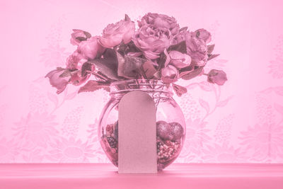 Close-up of roses in vase on table